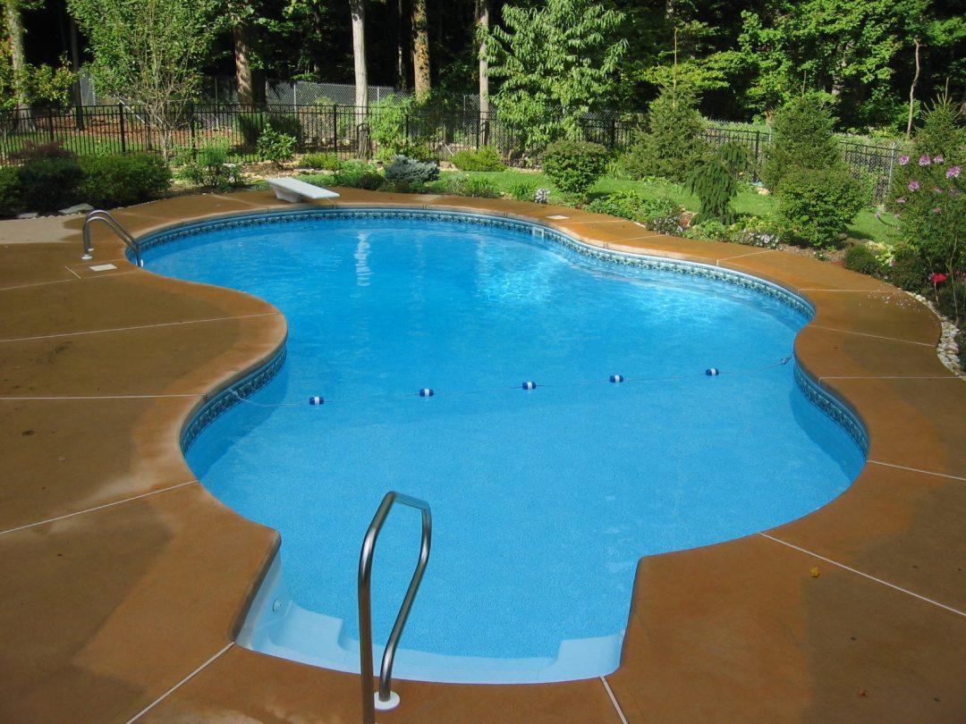 free form pool with diving board
